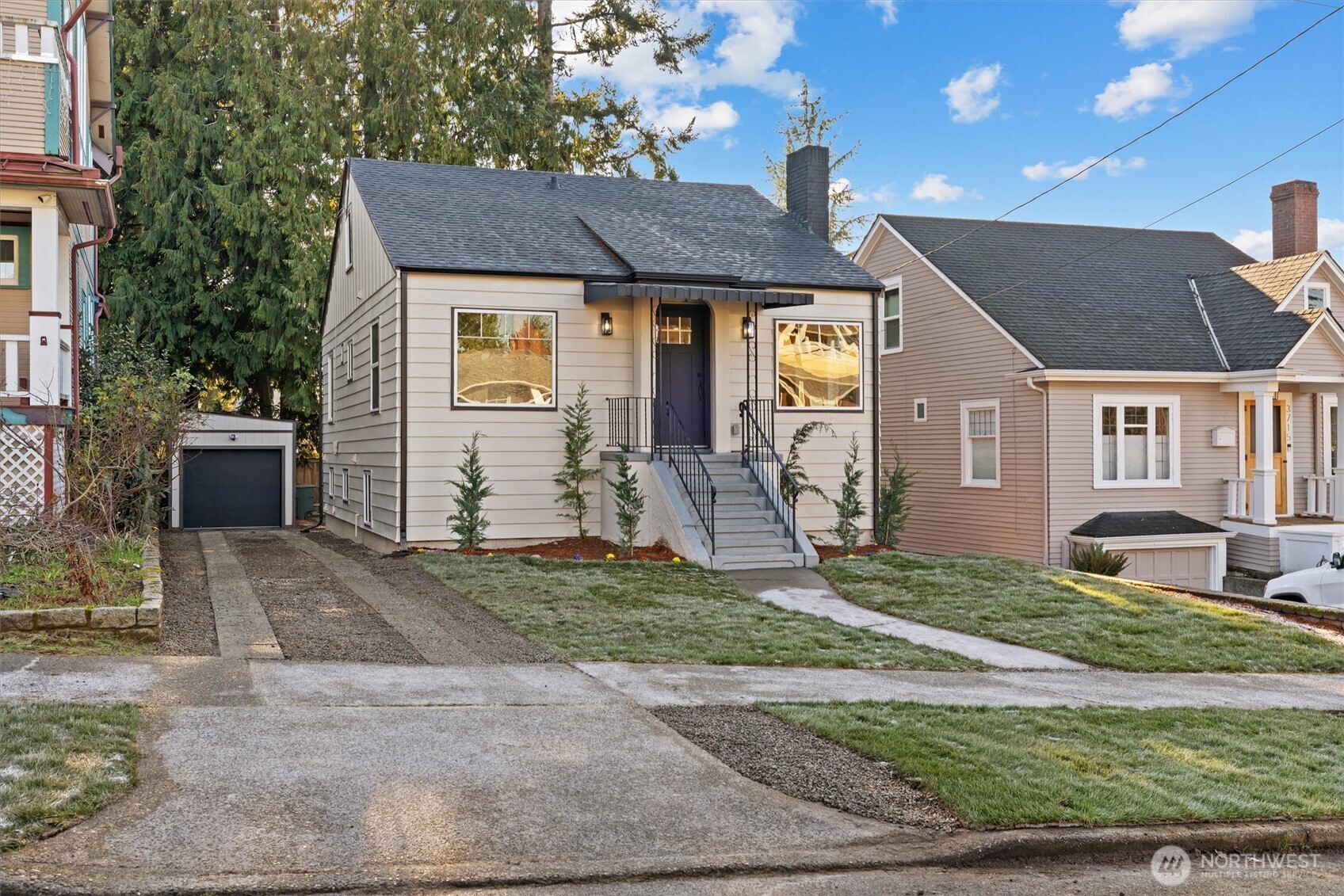 3711 Southwest Webster Street Seattle, WA 98126 - Photo 34 of 39 a front view of a house with a yard