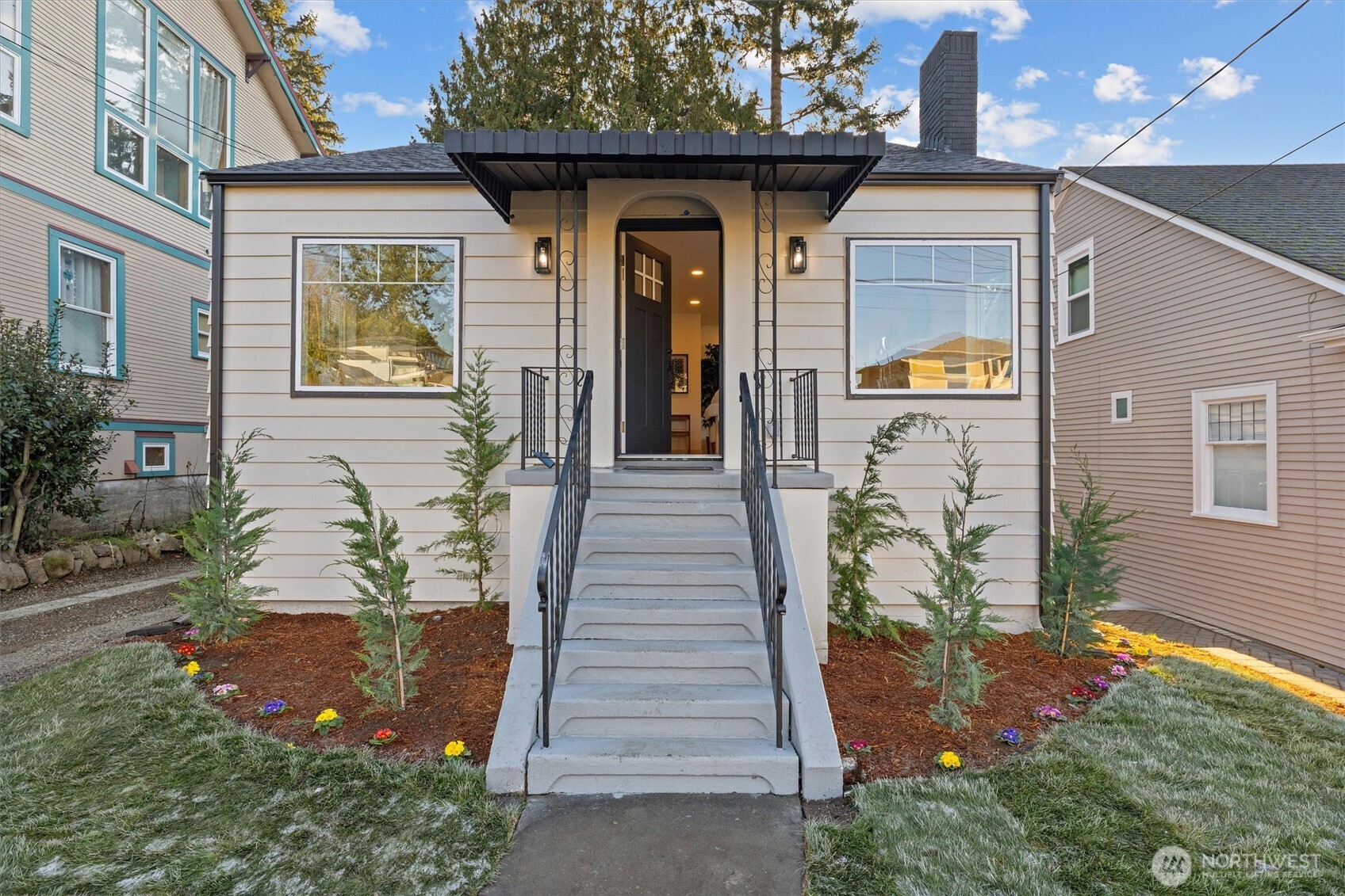 3711 Southwest Webster Street Seattle, WA 98126 - Photo 36 of 39 a front view of a house with a yard