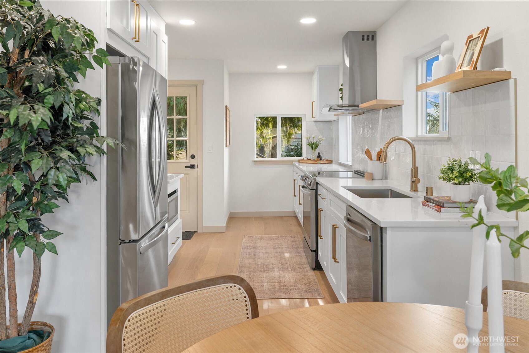 3711 Southwest Webster Street Seattle, WA 98126 - Photo 10 of 39 a kitchen with stainless steel appliances granite countertop a refrigerator and a stove