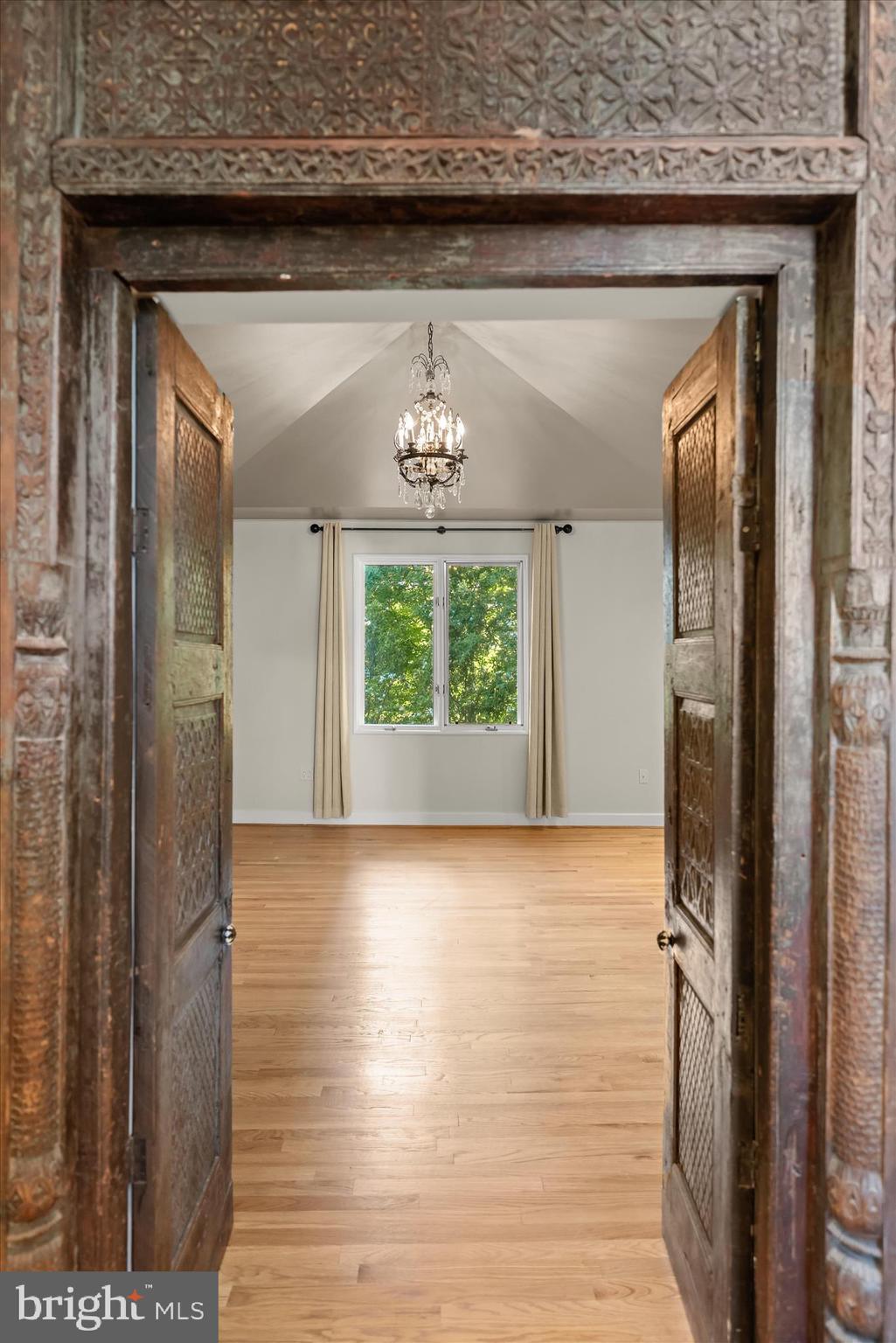 5104 Scarsdale Road Bethesda, MD 20816 - Photo 32 of 68 a view of a hallway with wooden floor and a window