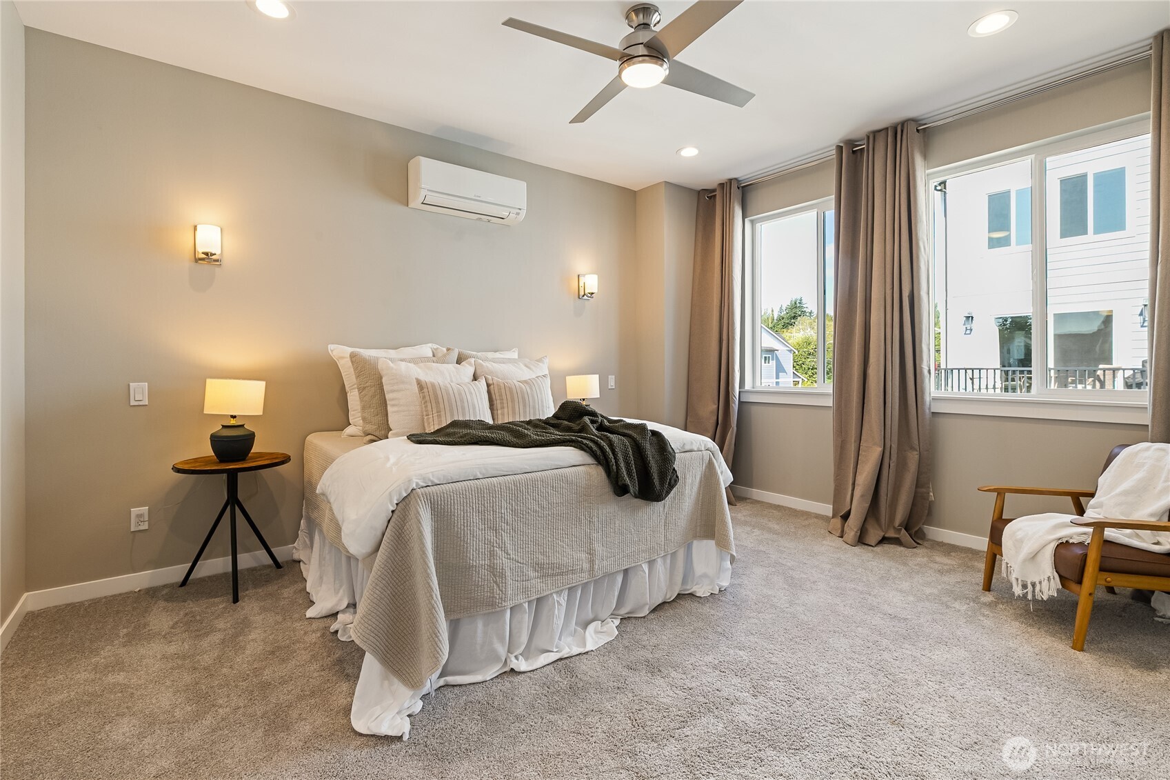 5686 Sunstone Place, Unit 101 Ferndale, WA 98248 - Photo 14 of 32 a bedroom with a bed and a chandelier