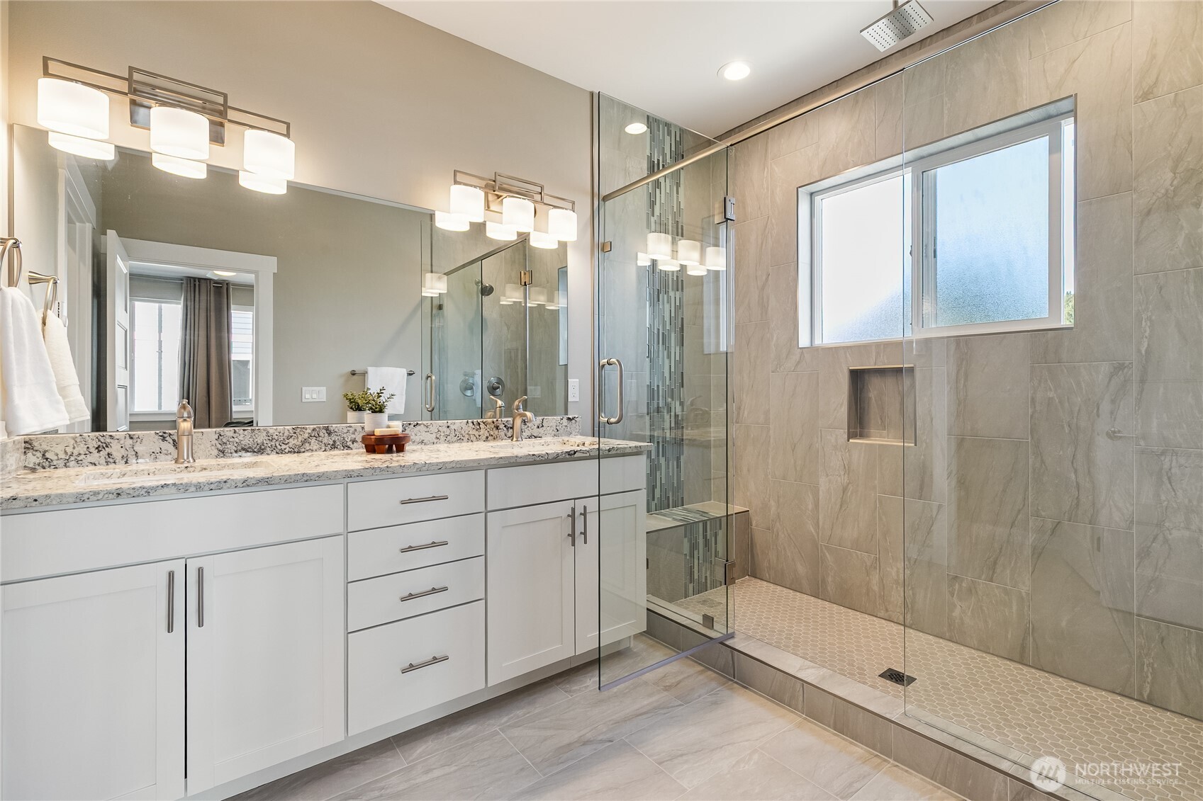 5686 Sunstone Place, Unit 101 Ferndale, WA 98248 - Photo 17 of 32 a bathroom with a double vanity sink and mirror
