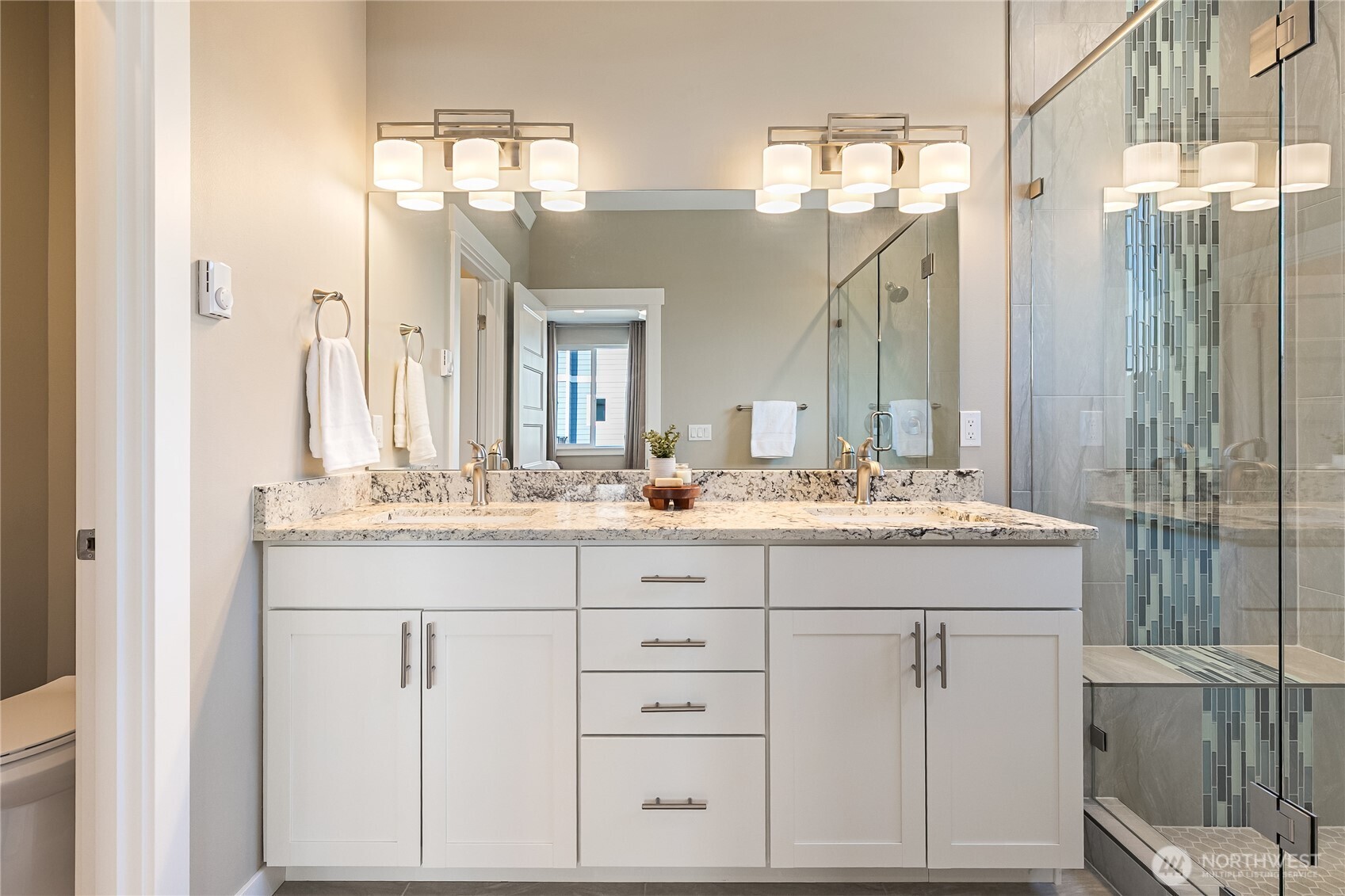 5686 Sunstone Place, Unit 101 Ferndale, WA 98248 - Photo 19 of 32 a bathroom with a sink vanity and a mirror