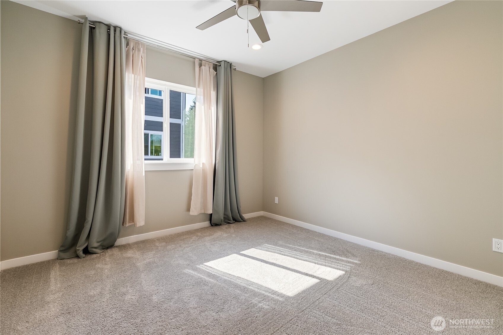 5686 Sunstone Place, Unit 101 Ferndale, WA 98248 - Photo 21 of 32 an empty room with windows
