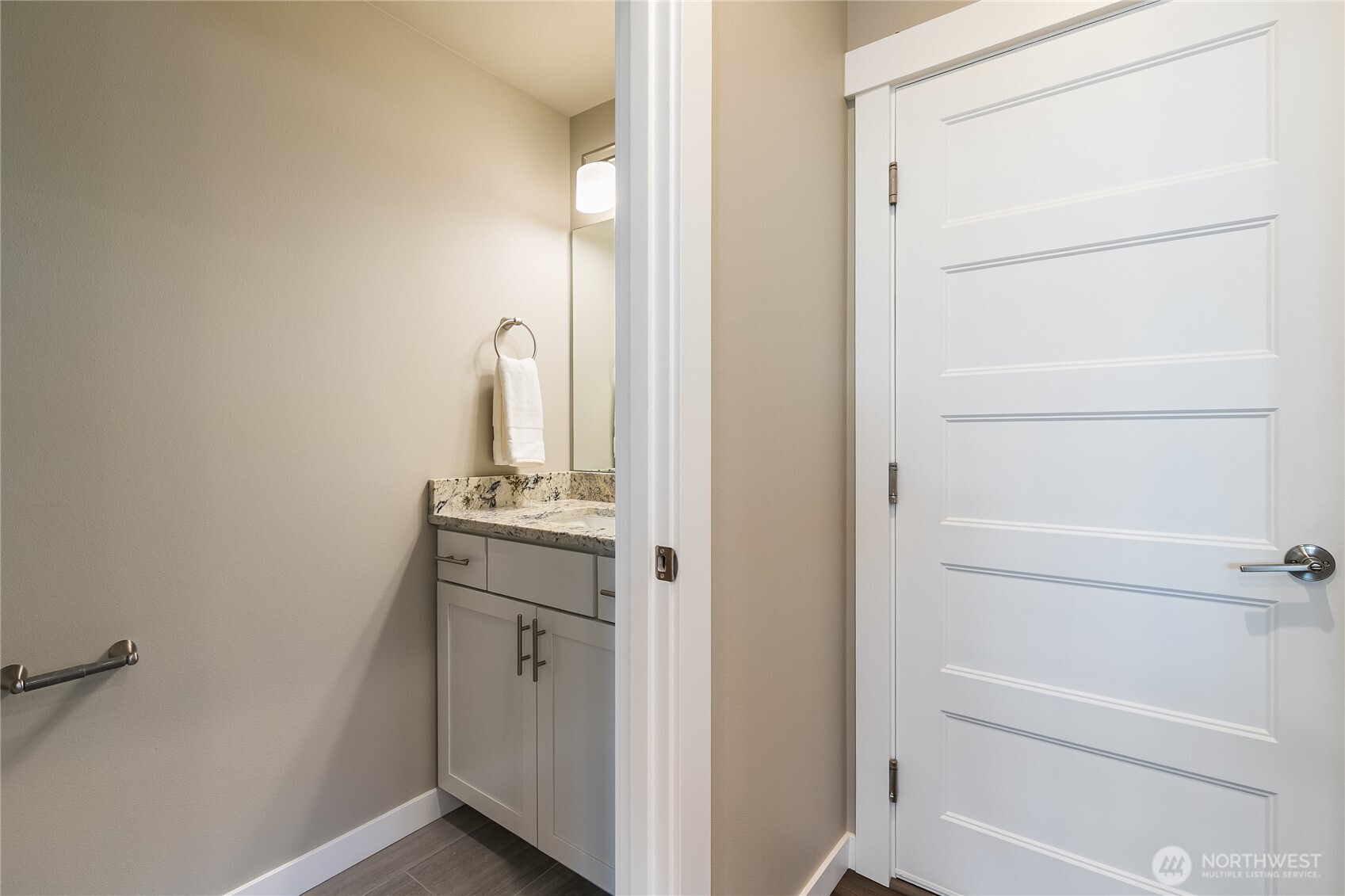 5686 Sunstone Place, Unit 101 Ferndale, WA 98248 - Photo 26 of 32 a bathroom with a sink and mirror