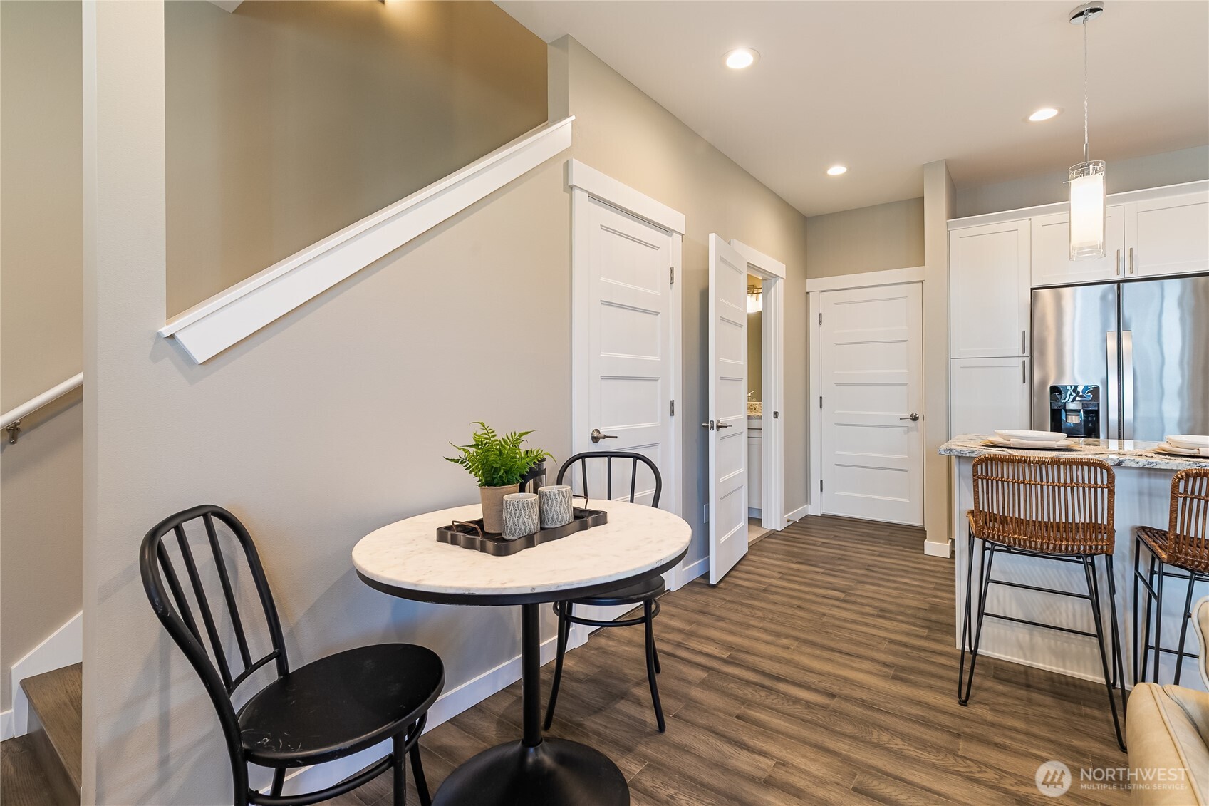 5686 Sunstone Place, Unit 101 Ferndale, WA 98248 - Photo 7 of 32 a view of a a dining room with furniture window and wooden floor