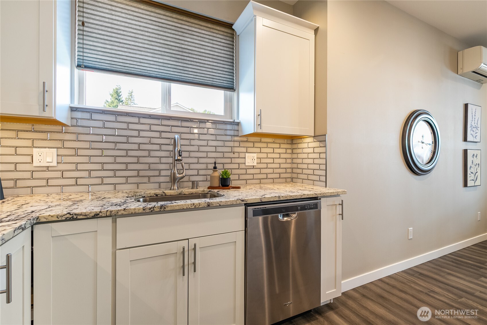 5686 Sunstone Place, Unit 101 Ferndale, WA 98248 - Photo 10 of 32 a kitchen with stainless steel appliances granite countertop a sink and a window