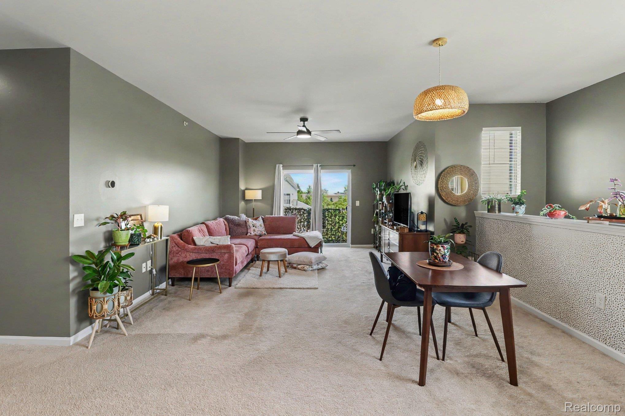 9864 Ridge Run Street Howell, MI 48855 - Photo 4 of 23 Dining space featuring ceiling fan and light colored carpet