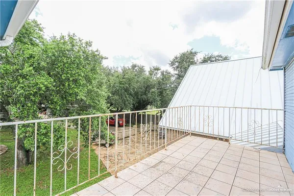 a balcony with wooden floor