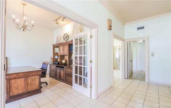 a view of kitchen with furniture and refrigerator