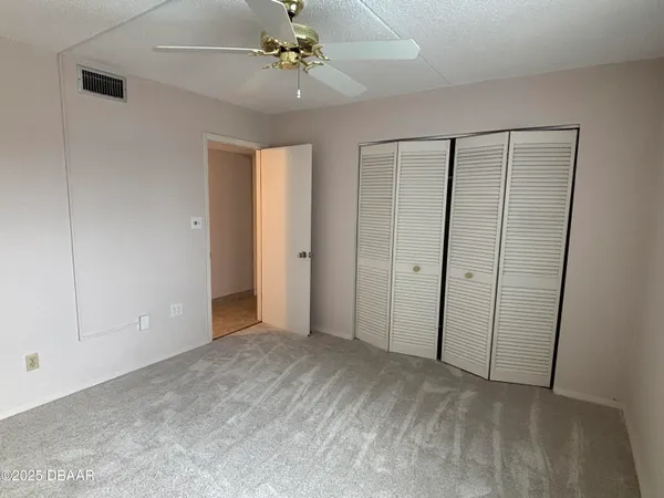 a view of empty room with fan
