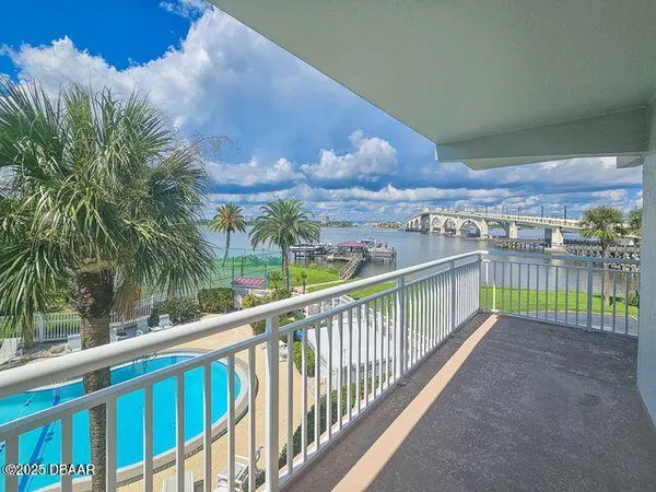 a view of a balcony with city