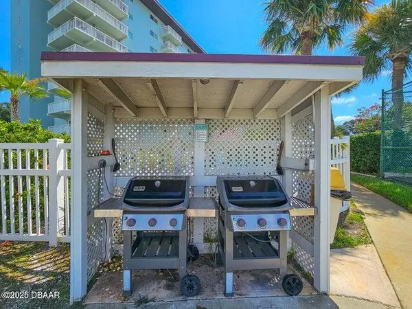 a view of a balcony with furniture