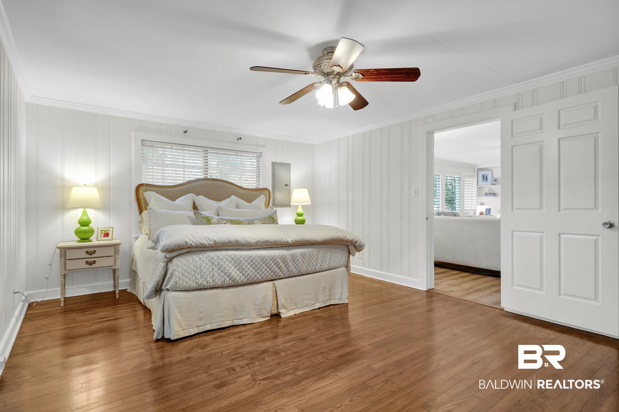 18 York Place Mobile, AL 36608 - Photo 17 of 27 Bedroom with wood finished floors, ornamental molding, multiple windows, a ceiling fan, and electric panel