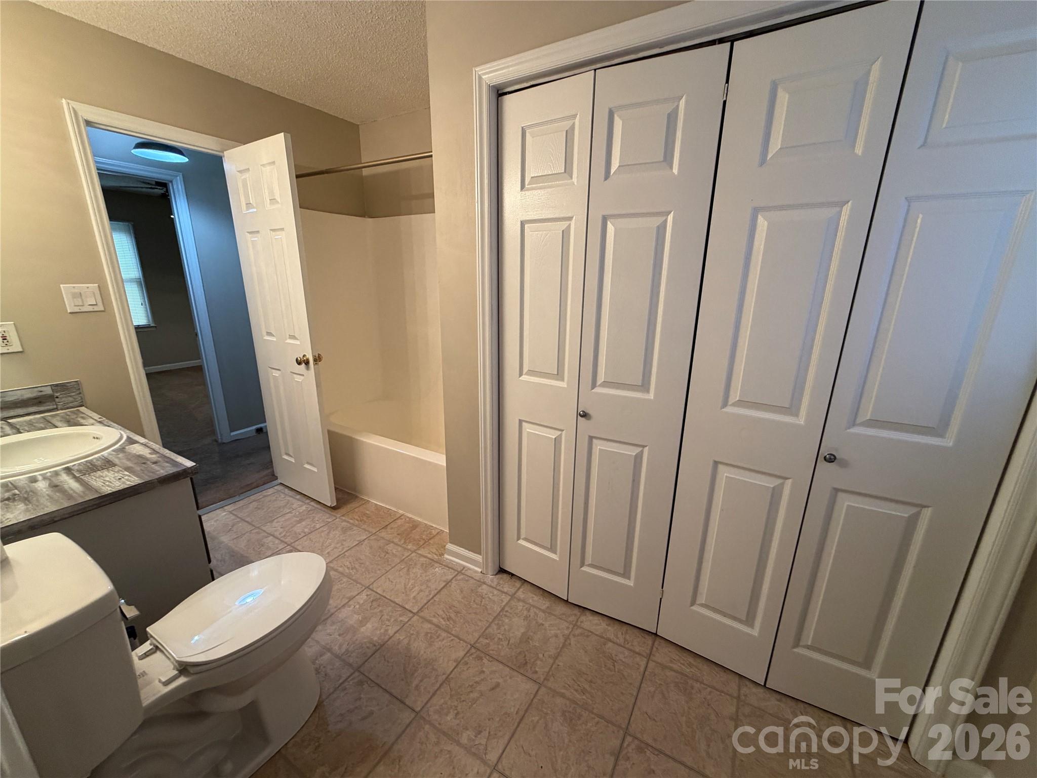 4051 Plum Street Conover, NC 28613 - Photo 6 of 10 a bathroom with a granite countertop sink and a mirror