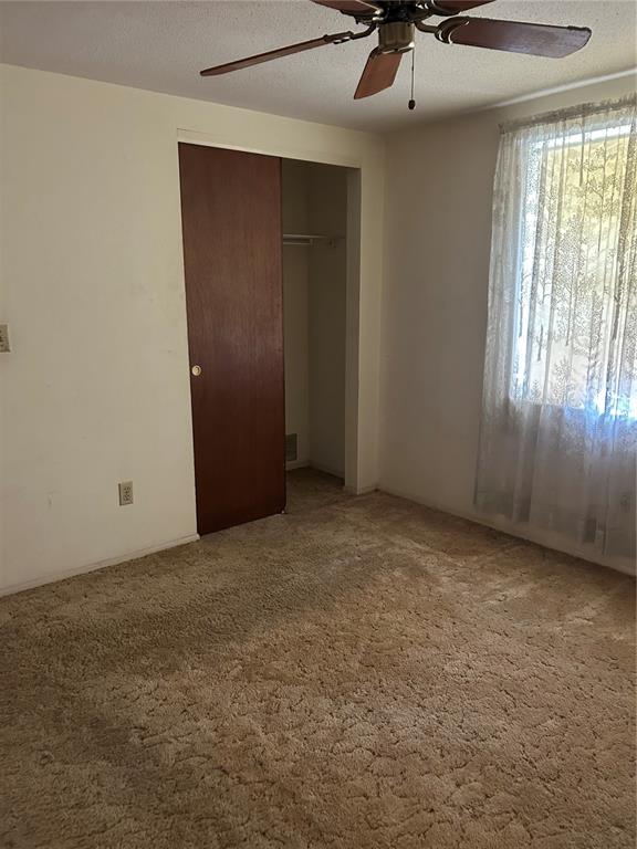 8511 Longboat Lane Hudson, FL 34667 - Photo 13 of 17 an empty room with a window
