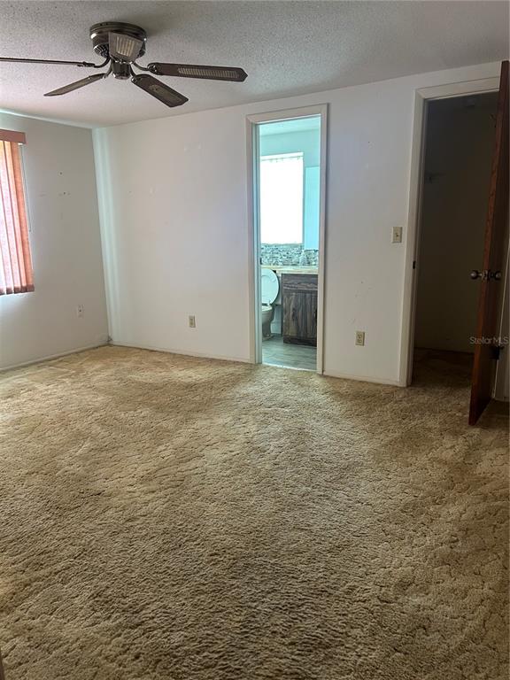 8511 Longboat Lane Hudson, FL 34667 - Photo 14 of 17 an empty room with windows