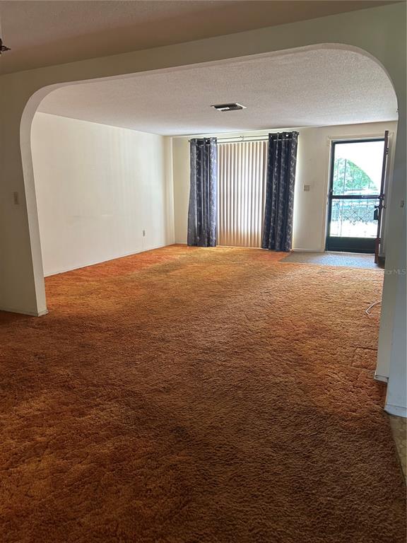 8511 Longboat Lane Hudson, FL 34667 - Photo 5 of 17 a view of an empty room with a window