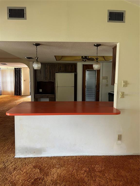 8511 Longboat Lane Hudson, FL 34667 - Photo 8 of 17 a view of a living room with kitchen island