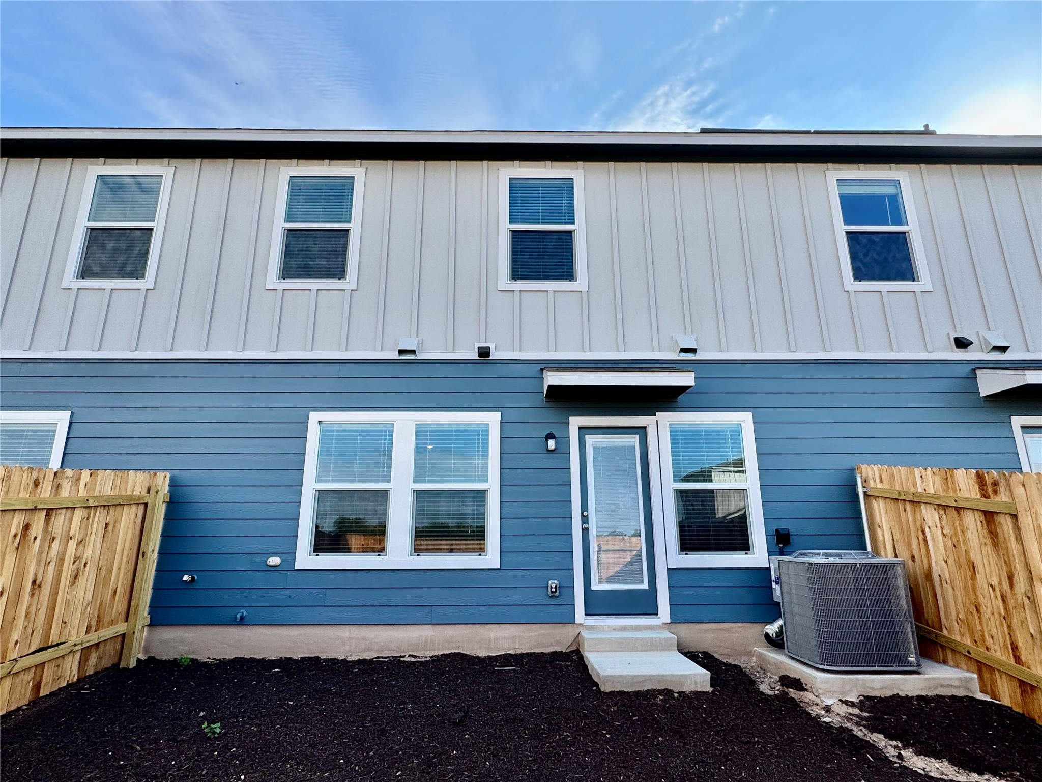 134 Cinnabar Lane, Unit 3 Kyle, TX 78640 - Photo 5 of 7 a brick house with four windows