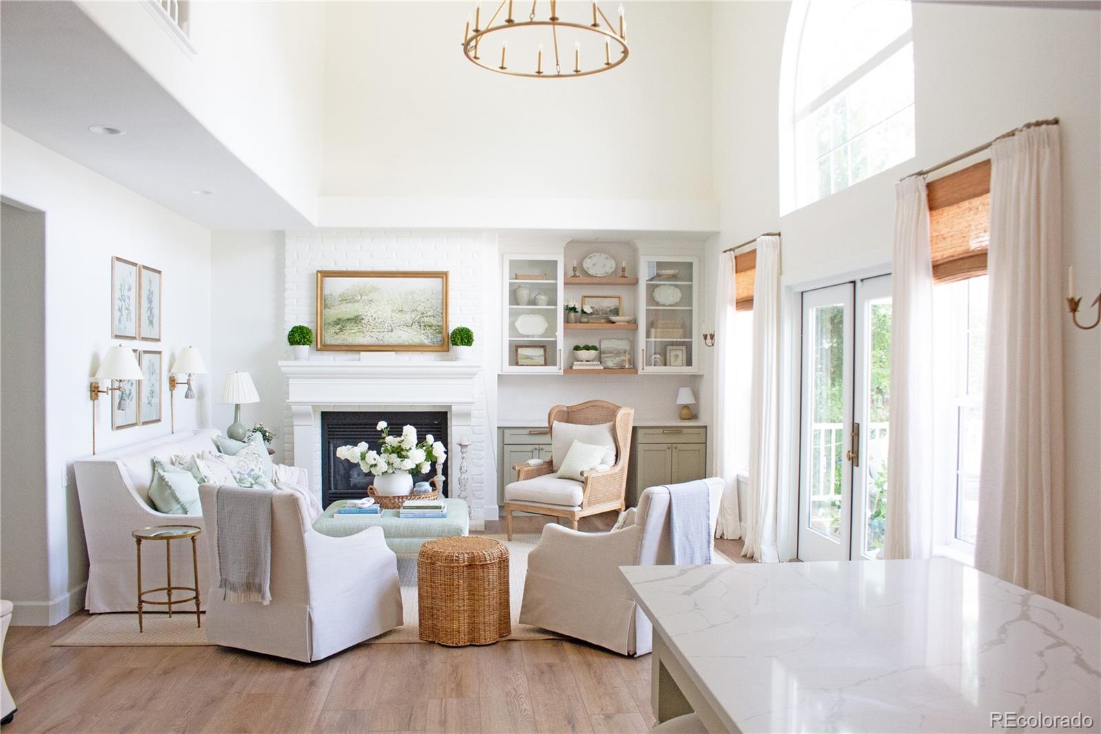369 Shoreham Circle Castle Pines, CO 80108 - Photo 15 of 41 a living room with furniture and a fireplace