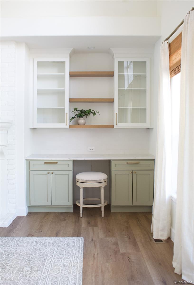 369 Shoreham Circle Castle Pines, CO 80108 - Photo 18 of 41 a room with a cabinets and a window