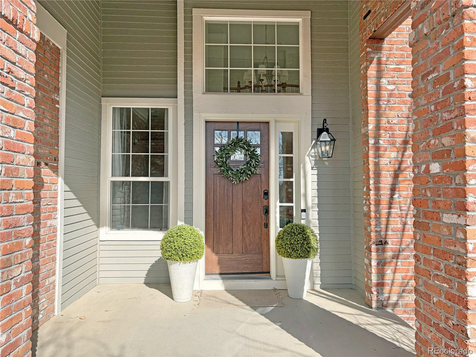 369 Shoreham Circle Castle Pines, CO 80108 - Photo 2 of 41 a view of a entryway of the house