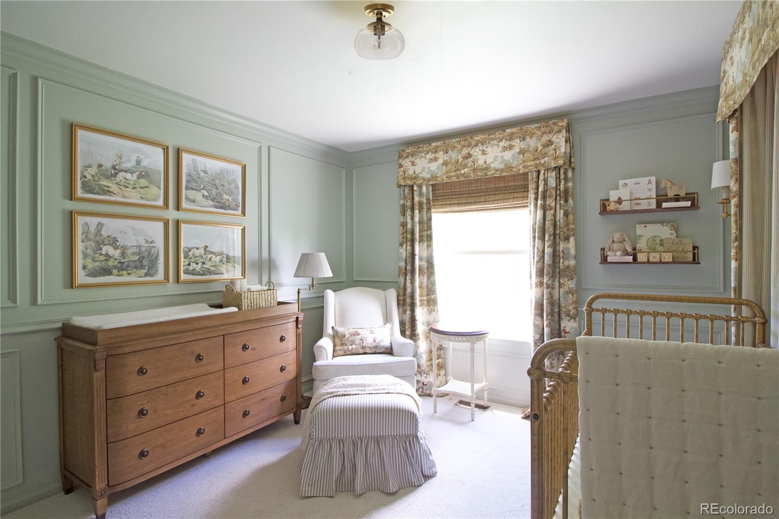 369 Shoreham Circle Castle Pines, CO 80108 - Photo 25 of 41 a bedroom with a bed and a dresser