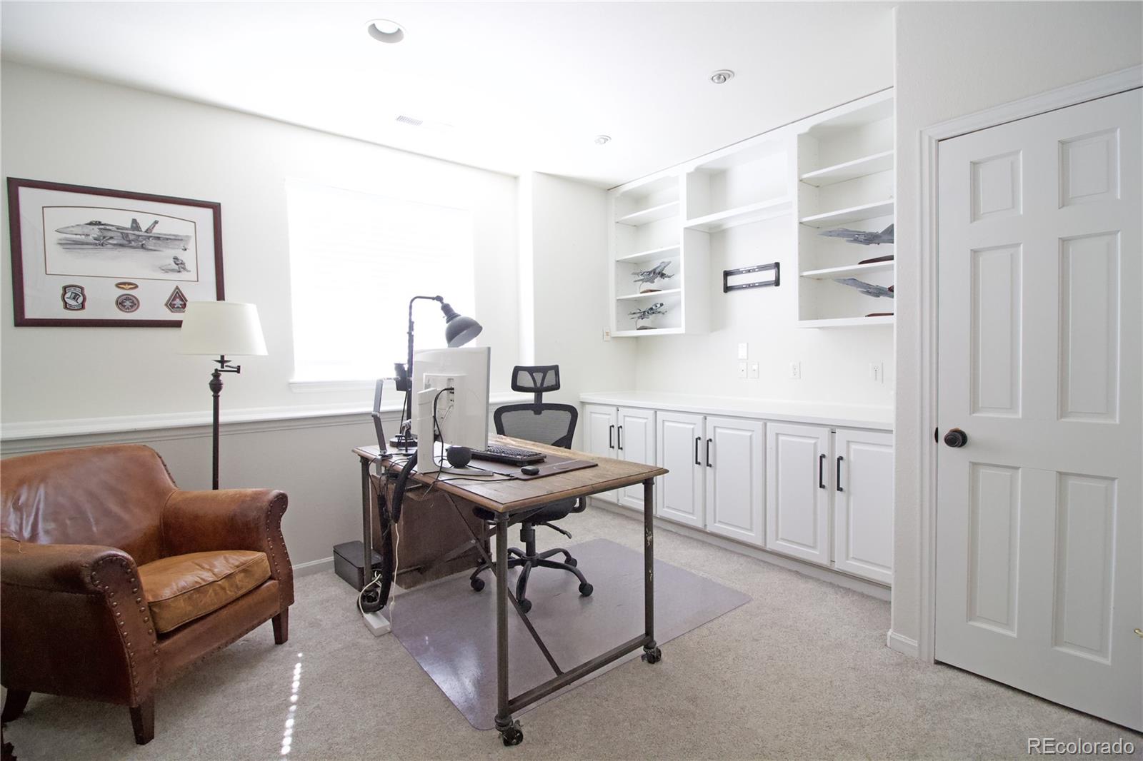 369 Shoreham Circle Castle Pines, CO 80108 - Photo 33 of 41 a view of a livingroom with furniture and a window