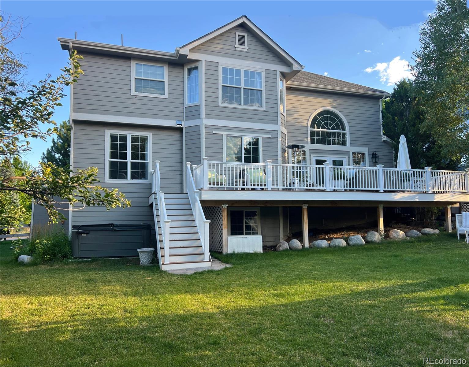 369 Shoreham Circle Castle Pines, CO 80108 - Photo 37 of 41 a front view of a house with garden