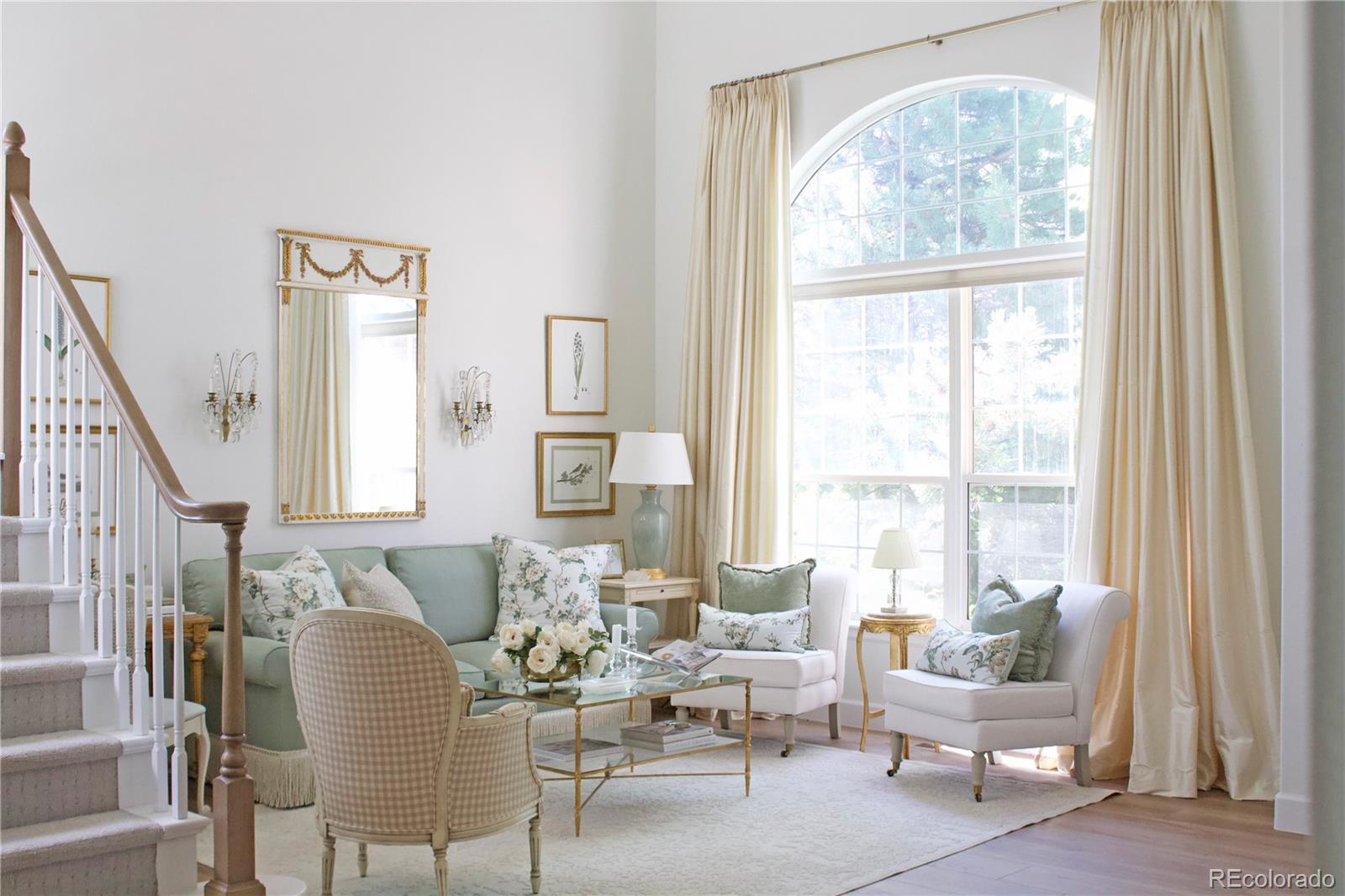 369 Shoreham Circle Castle Pines, CO 80108 - Photo 5 of 41 a living room with furniture and a window