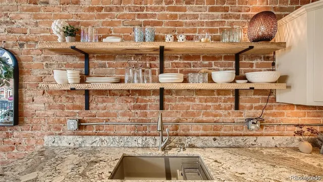 a bathroom with a sink toilet and mirror