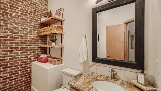 a view of a livingroom with furniture and a fireplace