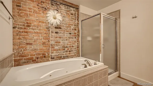 a bedroom with double bed and a window