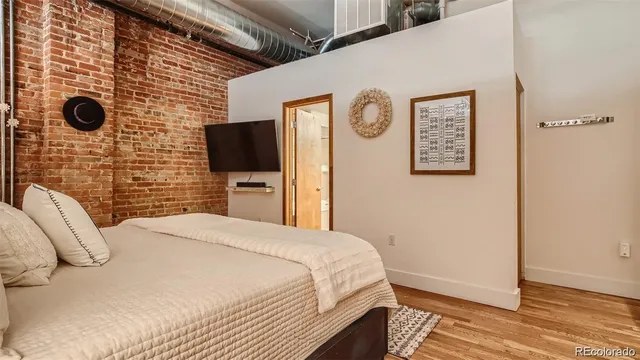 a bathroom with a granite countertop tub a sink and a large mirror