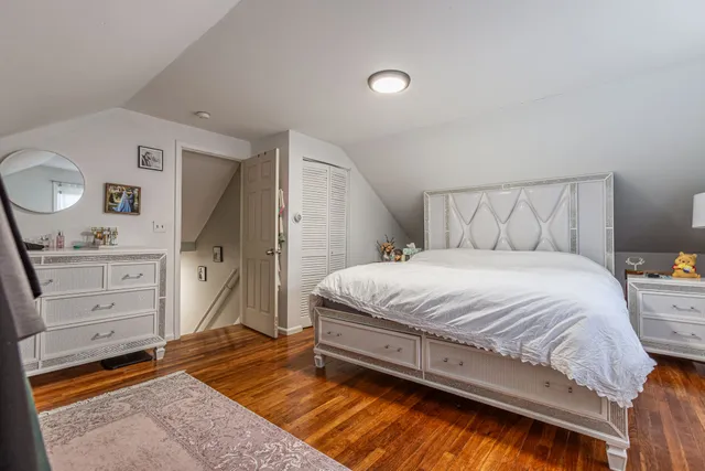 a bedroom with a bed and cabinets