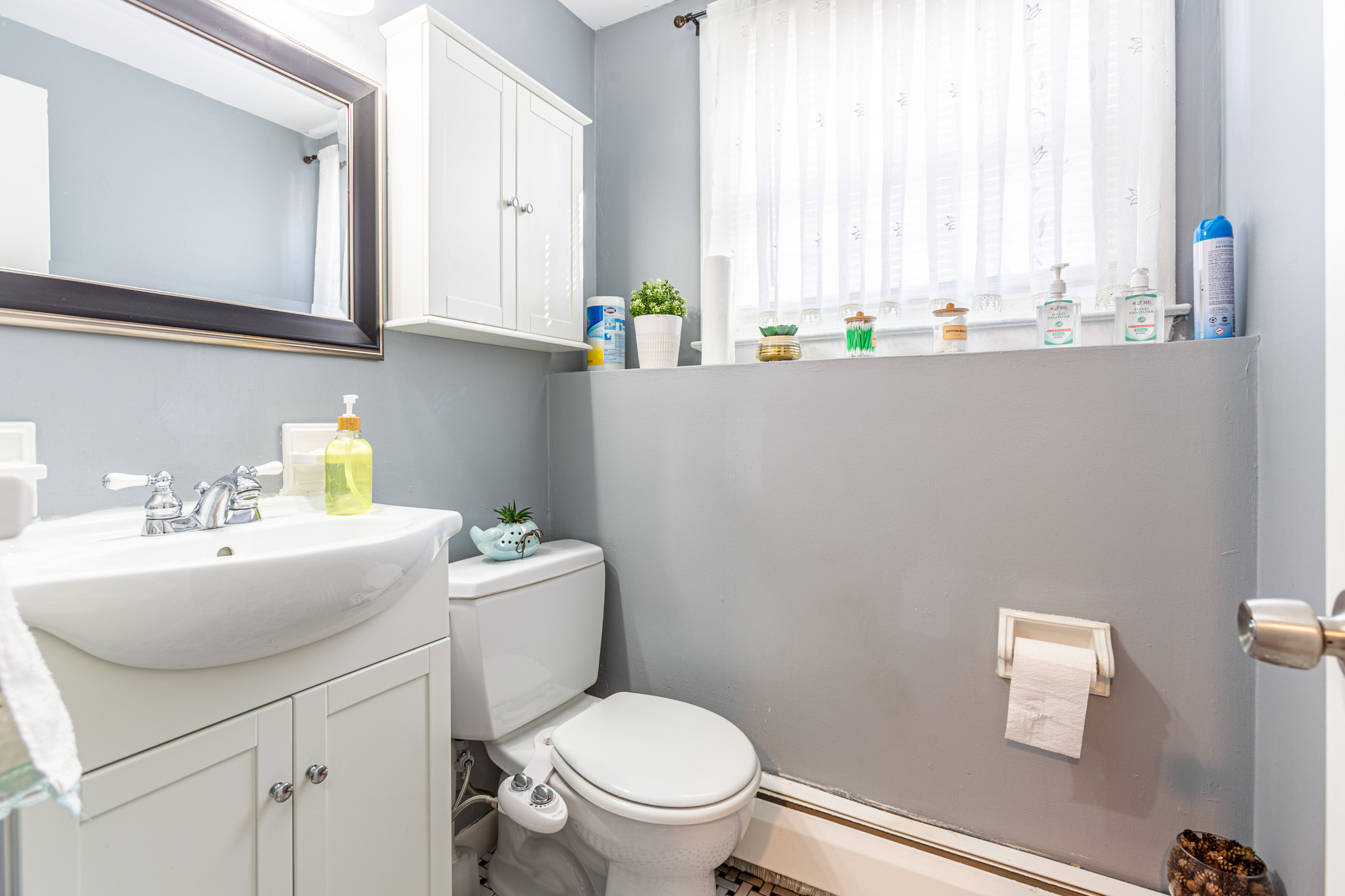 91 Goebel Road Hamden, CT 06514 - Photo 23 of 39 a bathroom with a sink a toilet and a window