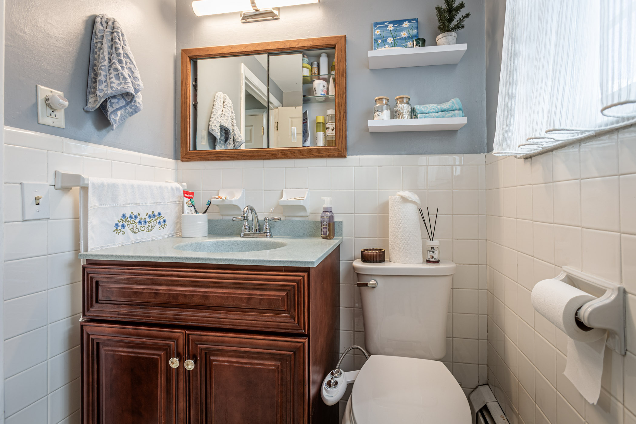 91 Goebel Road Hamden, CT 06514 - Photo 30 of 39 a bathroom with a sink a toilet and a mirror
