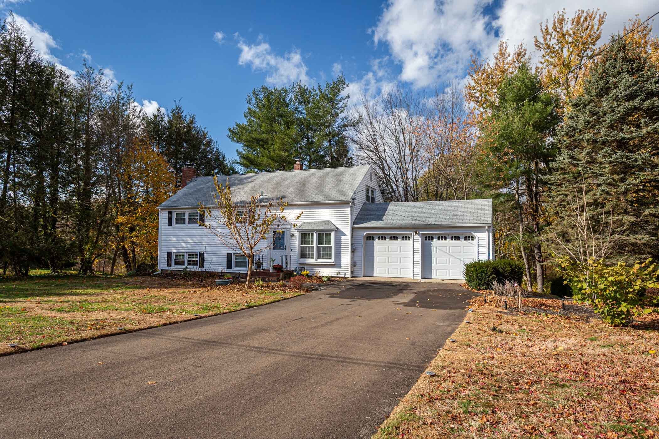 91 Goebel Road Hamden, CT 06514 - Photo 3 of 39 a view of a house with a big yard and large trees