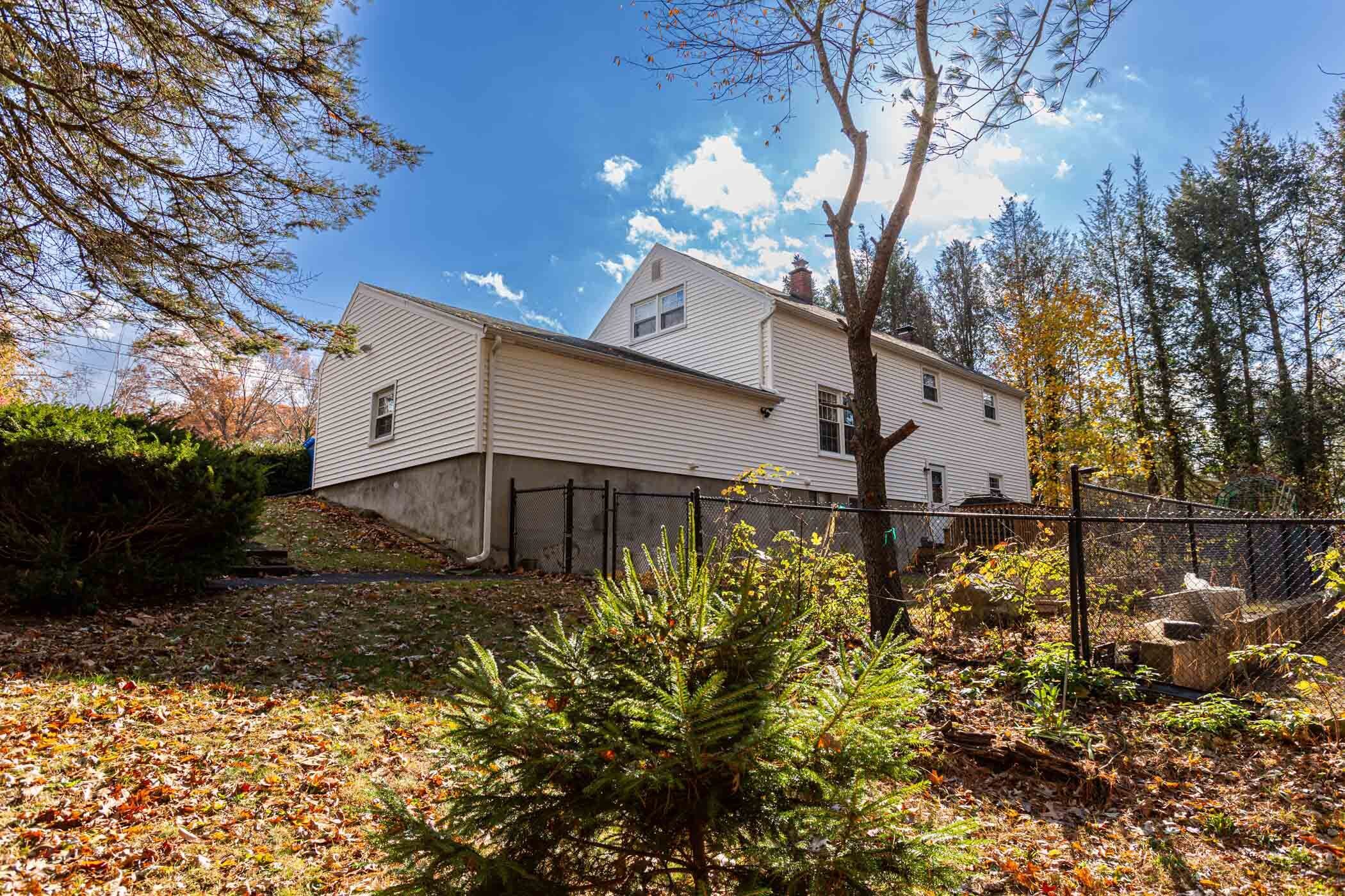 91 Goebel Road Hamden, CT 06514 - Photo 36 of 39 a view of a house with a yard