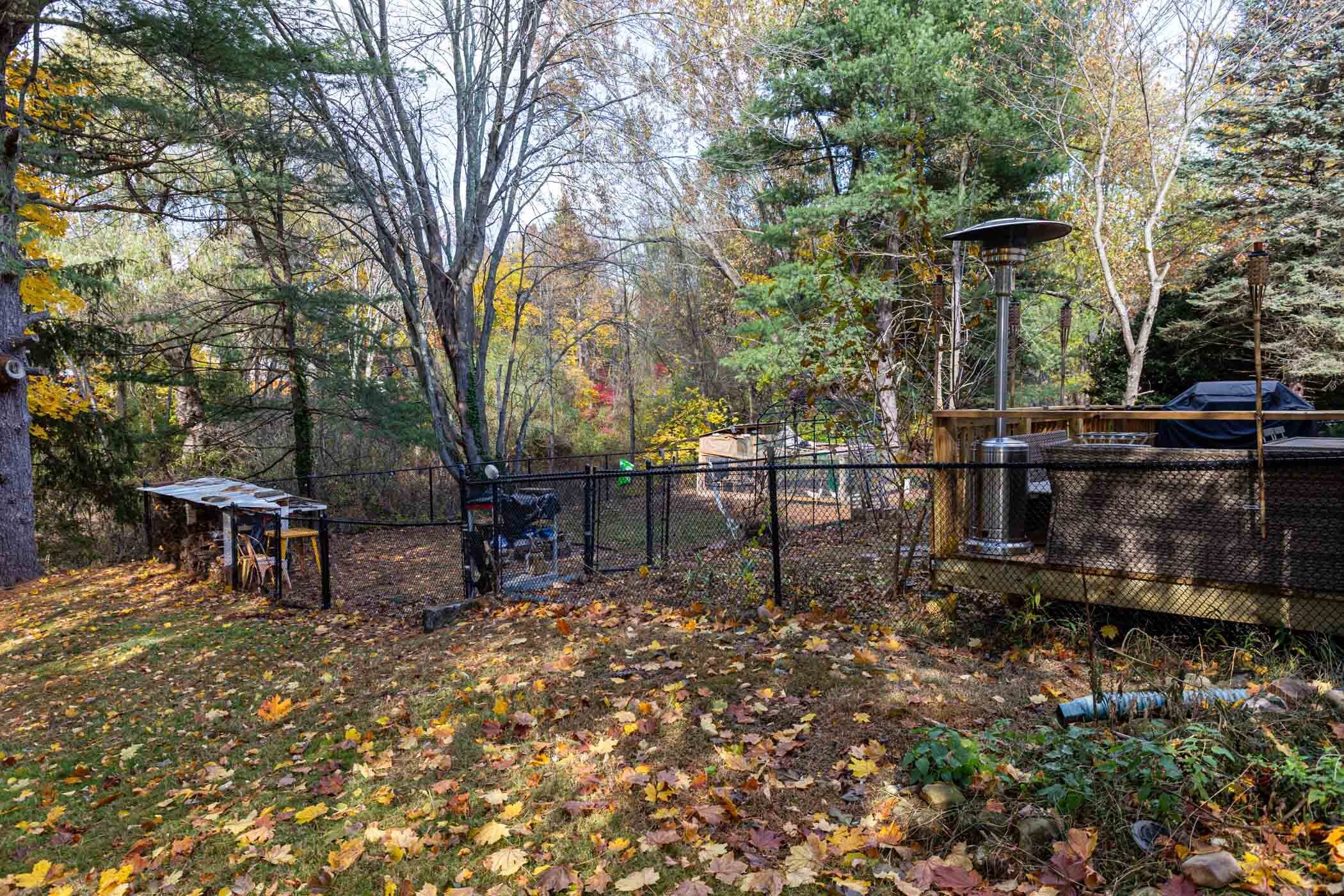 91 Goebel Road Hamden, CT 06514 - Photo 37 of 39 a view of a park with bench and some trees