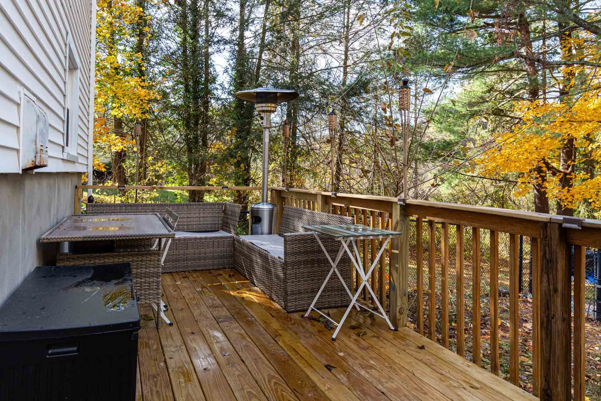 91 Goebel Road Hamden, CT 06514 - Photo 8 of 39 a view of a balcony with chairs and wooden floor