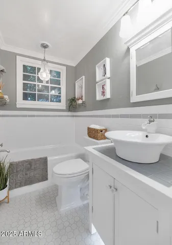 a bathroom with a sink and a toilet