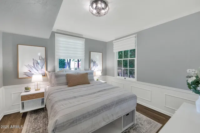 a bedroom with a large bed and a window