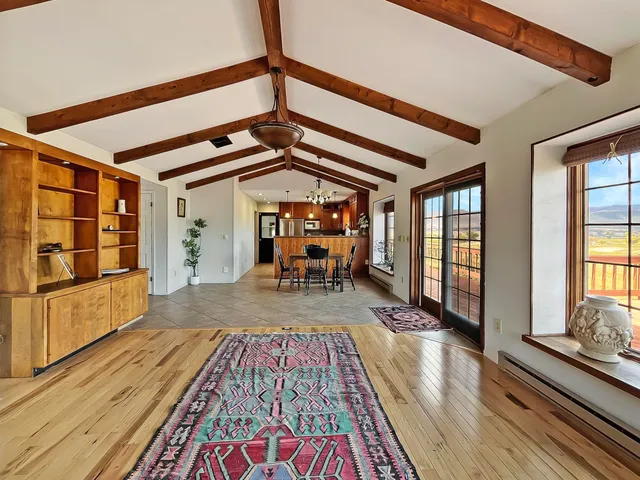 a kitchen with stainless steel appliances wooden cabinets a sink and a window
