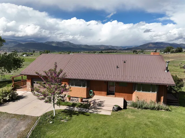 an outdoor view of house with garden and staircase