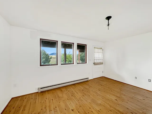 an aerial view of a house with a yard basket ball court and outdoor seating