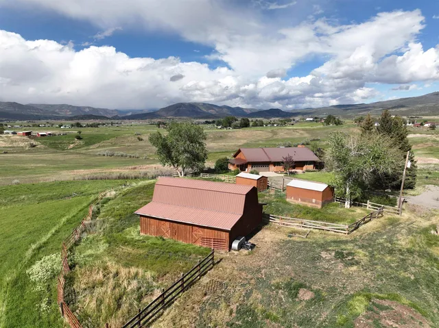 a very nice looking dining room with a table and chairs
