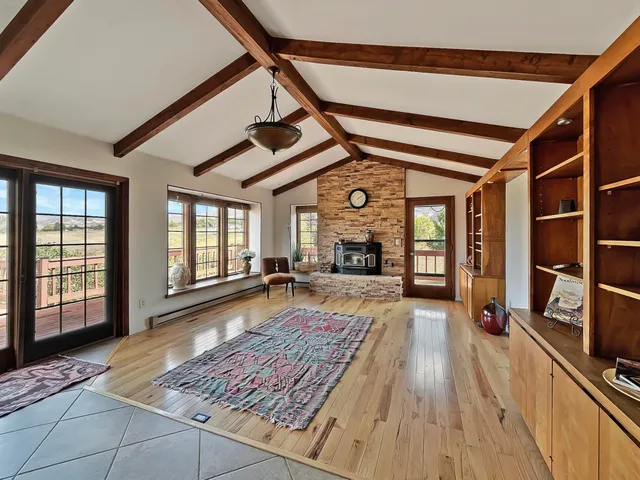 a kitchen with stainless steel appliances granite countertop a sink window and refrigerator
