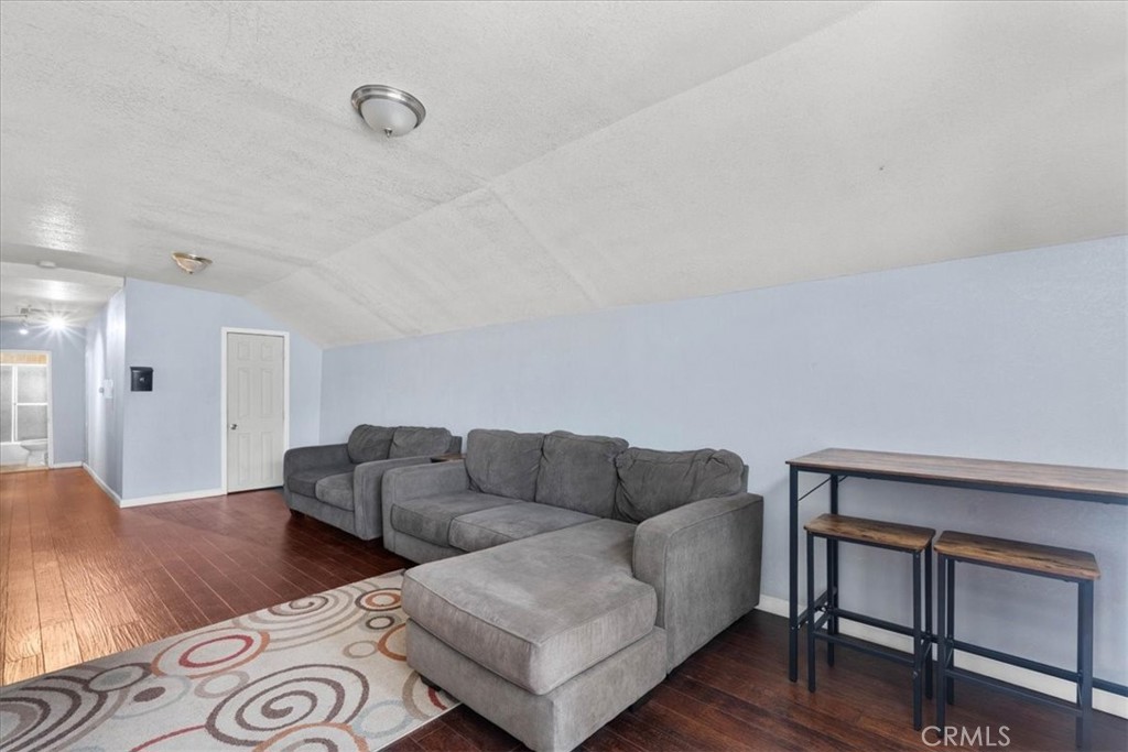 3974 5th Street Riverside, CA 92501 - Photo 33 of 45 a living room with furniture and wooden floor